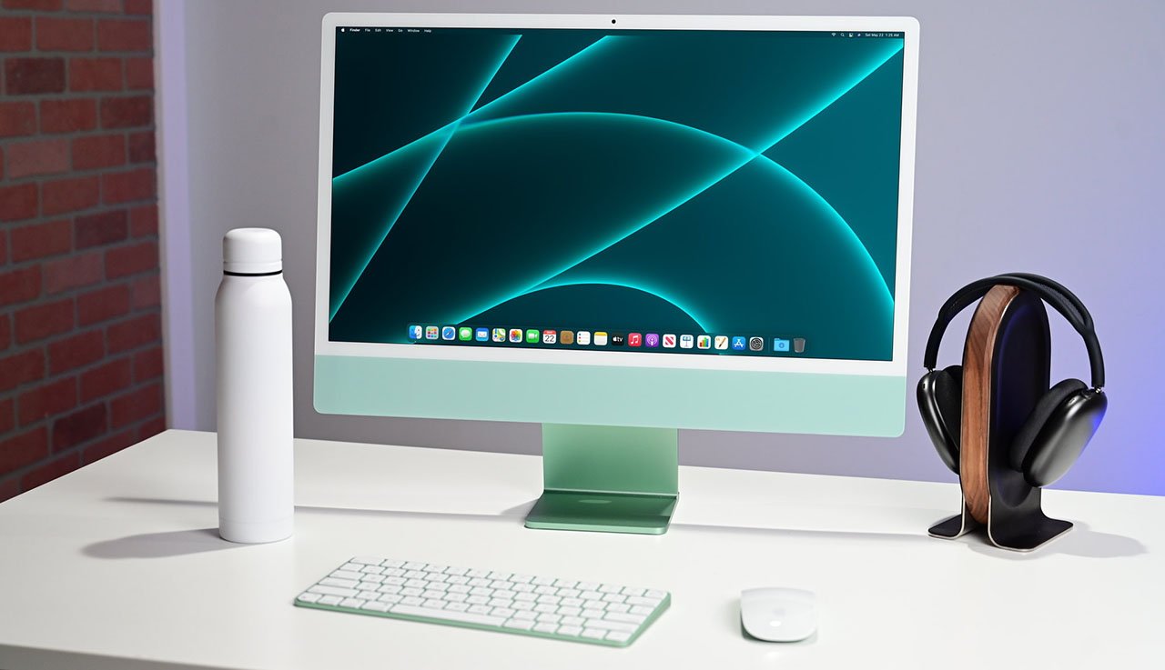 Настольный компьютер Apple «все в одном» сильно сокращается из-за сделок с открытой коробкой |  iMac 24 дюйма зеленого цвета на столе
