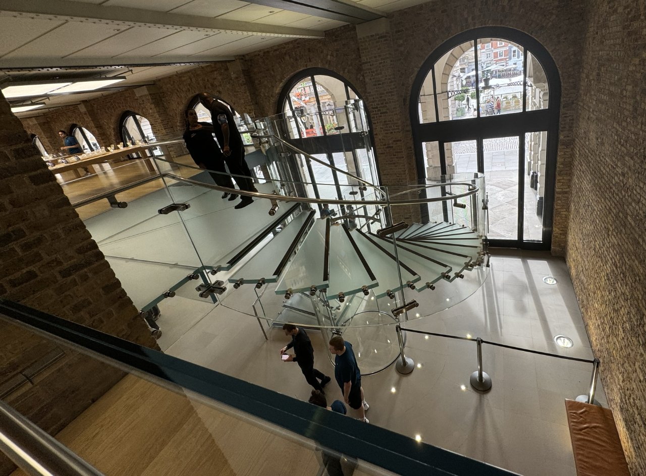 Looking down a circular glass staircase