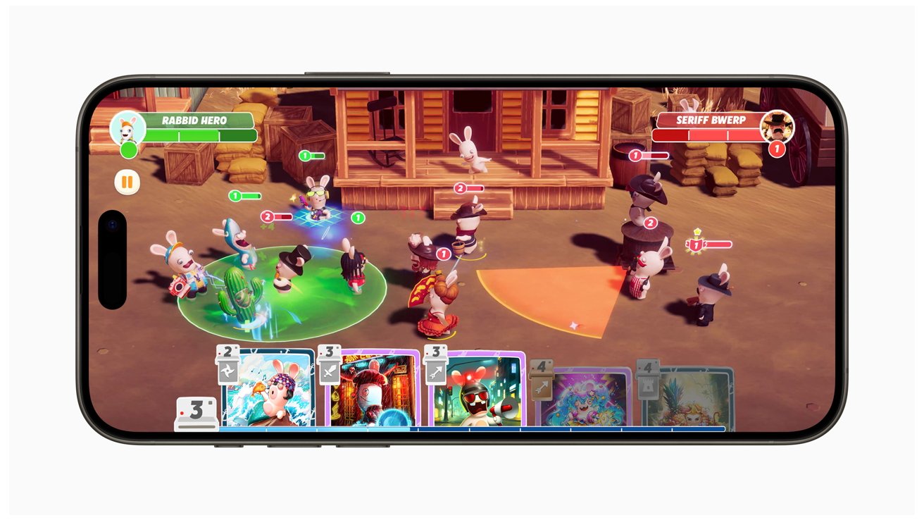 Смартфон с красочной пошаговой стратегической игрой с участием мультяшных кроликов в обстановке Дикого Запада.