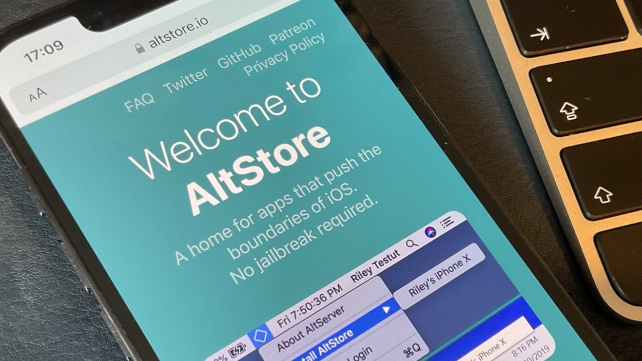 Экран iPhone с надписью «Добро пожаловать в AltStore», дом для приложений, расширяющих границы iOS.  Джейлбрейк не требуется, рядом с клавиатурой ноутбука.